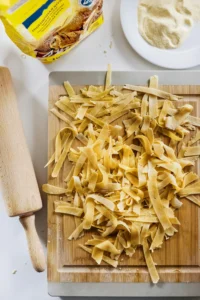 Rustic Homemade Pasta Preparation on Wooden Board