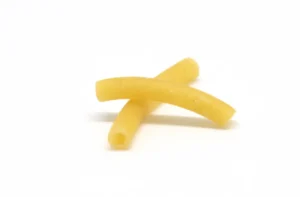 Macaroni pasta showing the unique curved shape and ridges.