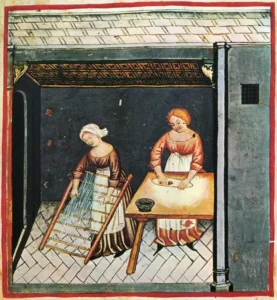 Pasta History: Ancient illustration of traditional pasta making in a medieval kitchen, showing historical dough preparation and drying techniques.