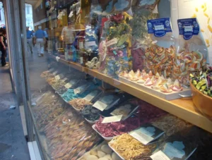A traditional Italian pasta shop display in Venice featuring various artisanal pasta shapes..
