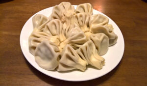 Freshly cooked Meat-Filled Tortelloni served in rich sage butter sauce