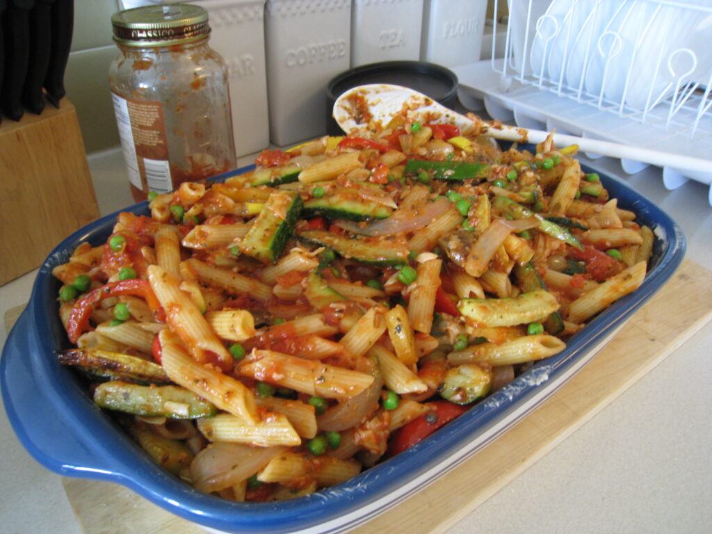 Roasted Vegetable Whole-Wheat Pasta topped with fresh herbs and Parmesan cheese.