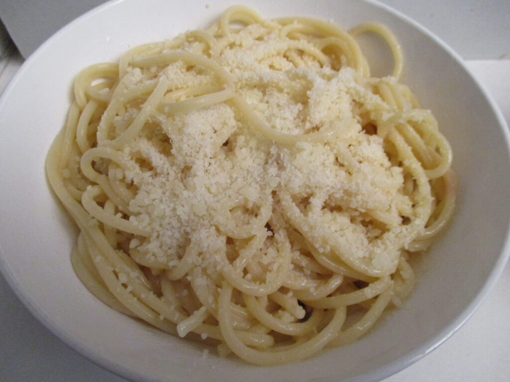 A delicious plate of Easy Garlic Butter Parmesan Spaghetti garnished with fresh parsley.
